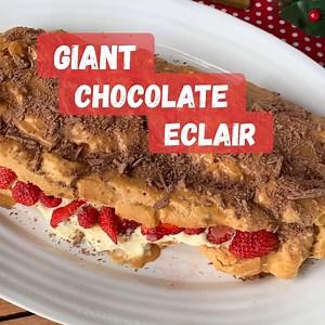 109K views · 584 reactions | ✨Giant chocolate eclair✨ Filled with custard cream and strawberries  topped with Caramilk ganache and flake chocolate  Will it be on your Christmas Day menu? Recipe here: https://vjcooks.com/giant-chocolate-eclair/ ‍ | VJ cooks | Facebook