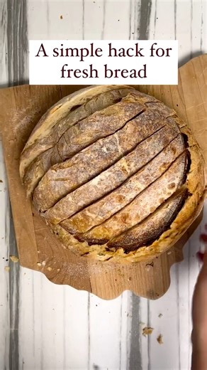 This simple hack is a game changer, especially in summer! 🌞 Sourdough bread doesn’t have preservatives which means it doesn’t last as long on the counter as store bought bread. All that hard work just to have your bread go moldy, not on my watch! So here’s how to keep your bread fresh FOR MONTHS! Start by slicing a cooled loaf of sourdough bread. Cut strips of parchment paper and place between each slice. Place the loaf in a freezer-safe bag and freeze. Then when you want a slice, pull it out a