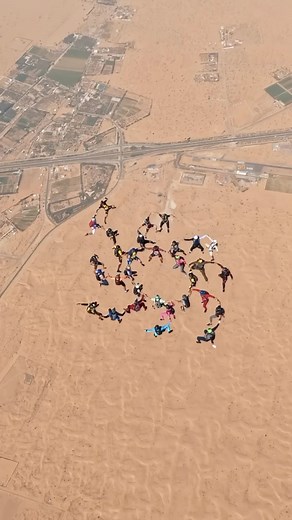 Skydivers in Dubai breaking records. 🪂 31 skydivers soared over the desert in Dubai setting a new UAE national record for the largest head-up skydiving formation. Where: Skydive Dubai’s Desert Campus #dubai #skydiving | Time Out Dubai