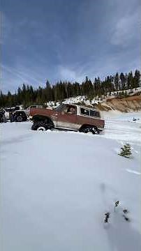 Turbo Diesel Squarebody K5 Blazer Struggling Up a Steep Snowy Hill