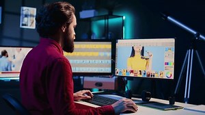 clip-3391589345-photographer-using-software-on-computer-perform-editing