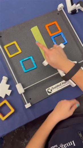 ImaginAble Solutions | Guided Hands on Instagram: "Did you know Guided Hands is being used in OT sessions? OTS have been loving this magnet tiles activity for midline crossing and visual-motor control. If you’re an OT looking for more ideas on how to use Guided Hands® in your sessions… Comment “webinar” and we’ll send you the link to sign up. . . #OccupationalTherapy #OTTools #VisualMotorSkills #MidlineActivities #HandwritingSkills #OTActivities #AssistiveTechnology #GuidedHands #MotorPlanning #