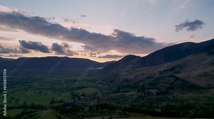 4k footage of the sunrise behind the hills overlooking Keswick in Cumbria, UK