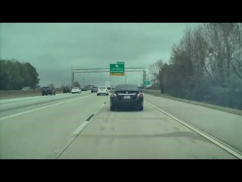 Car Clips Highway Exit Sign After Risky Merge