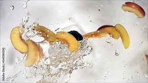 Super Slow Motion of Explosion Peach and Burst Water and Slices
