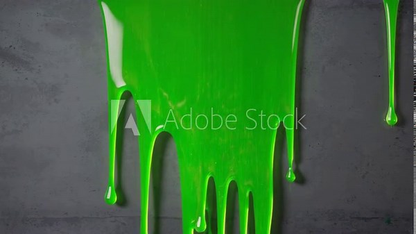 Bright green slime dripping down gray wall, textured surface, vibrant liquid flowing, abstract visual, playful creative design element
