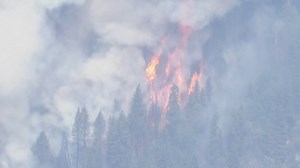 Explosive California wildfire 'knocking on the door' of Tahoe area