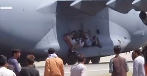 Video Shows Afghans Clinging To U.S. Military Plane As It Takes Off In Kabul