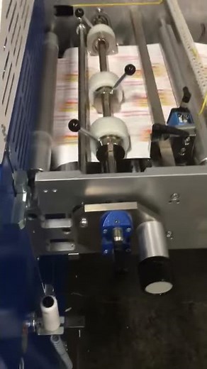 MBO Roll Fed Finishing system with SVC sheeter making 3 up post cards on mitra stacker