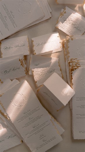 Papira • Alexandra Timita on Instagram: "A touch of luxury at every place setting. From the blind embossed monogram to the hand-applied gold leaf edges, these handmade paper menus and place cards were created as tiny works of art for a beautiful wedding this past season."