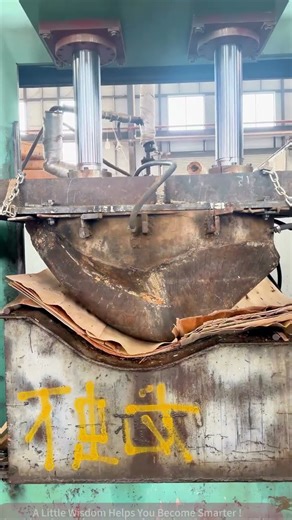 Watch how a metal press machine compresses cardboard under mechanical force