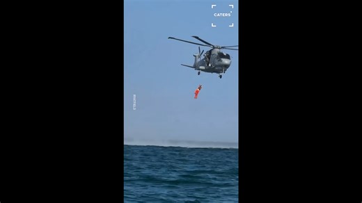 Royal Navy helicopter spots boat offshore and trains alongside at sea