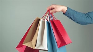 clip-1086466010-footage-man-hand-holding-many-paper-shopping