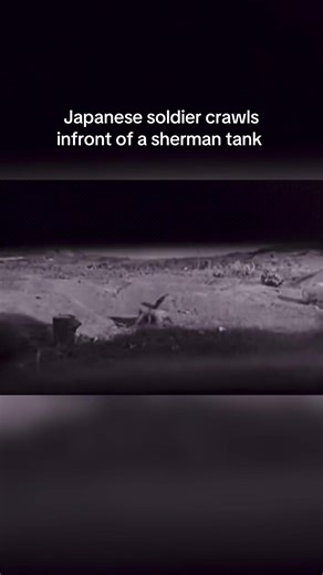 The footage shows a Japanese soldier crawling across open ground in front of an American M4 Sherman tank while the tank fires its machine guns toward him. The soldier continues to move forward despite the gunfire, showing how desperate close range attacks on tanks could be during the fighting in the Pacific. Japanese infantry sometimes attempted to approach tanks with explosives because they lacked strong anti tank weapons. Historians consider the footage real because it comes from original U.S.