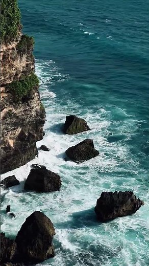 Rugged Coastline from Above Waves Crash on Rocks in 4K