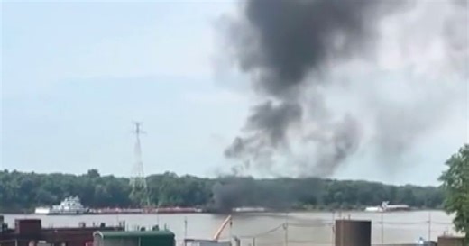 2 dead after helicopter strikes power line and crashes into barge on Mississippi River