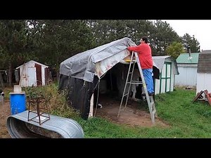 putting a new tarp on the tarp shed