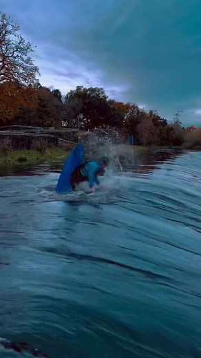 Kayaking tricks on a wild autumn river