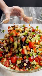 This Middle Eastern-style bean salad, also known as balela salad is made with simple ingredients, it’s fresh, flavorful, and can be served as a side dish or on its own. Plus, it’s full of good-for-you ingredients like chickpeas! Cre by @ Recipe 2 cans chickpeas (rinsed drained) 1 can black beans (rinsed and drained) 1 red bell pepper (chopped) 2 cups baby tomatoes (sliced in quarters) 1/2 small Persian cucumber (chopped) 1/2 red onion (chopped) 1/4 cup fresh parsley (chopped) 1/4 cup fresh mint 