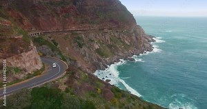 Aerial: Car driving on Chapman's Peak Drive, Cape Town, Africa