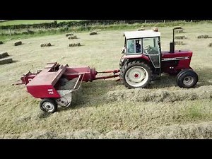 International 784 & International 440 baler assisted by a Ford 2000 creating the rows. .