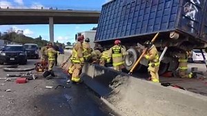 Grecia Aguilar was at the scene after a tractor-trailer collided with the center divide and a vehicle on northbound I-805 near Murray Ridge Rd. Saturday, and crews worked to free a passenger trapped under one of the big rig's tires. STORY (updating): http://bit.ly/2l942px | 10News – ABC San Diego KGTV