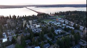 Cinematic 4K aerial drone dolly shot of the Evergreen Point floating bridge on Lake Washington with Medina, Hunts Point, Laurelhurst, mansions, luxury homes, villas
