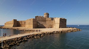 Island of Capo Rizzuto. Calabria Italy. The Aragon castle at Le Castella at dusk. - Date: 02.08.2024