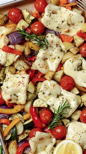 One Tray Bake Roasted Vegetable Bake with Melted Halloumi Halloumi and Vegetables: 8 slices of halloumi 2 medium potatoes, diced into 2cm cubes 1 large zucchini, diced 1 red capsicum, diced 1 yellow capsicum, diced 1 red onion, sliced into 8 wedges 250g cherry tomatoes Seasoning: ½ cup extra virgin olive oil 6 garlic cloves, finely chopped or minced 3 rosemary stalks, leaves removed and chopped 1 tablespoon dried Greek oregano 1 teaspoon smokey paprika Sea salt and freshly ground pepper Juice of