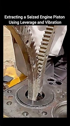 Extracting a Seized Engine Piston Using Leverage and Vibration.