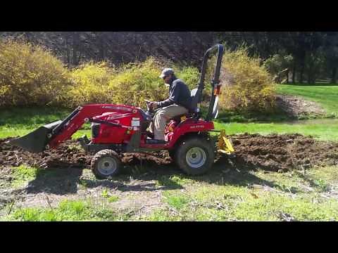 Massey GC1710 plowing a new garden spot with middle buster