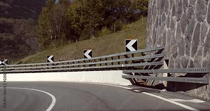 Driving in the alps, Cinema 4k pov view driving on a route with swiss alps, towards Brig city, on route e62, on a sunny autumn day, down from the Simplon pass, in Valais, Switzerland