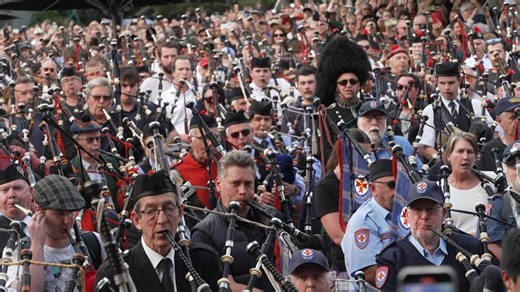 Bagpipers play tribute to AC/DC in world record attempt in Melbourne