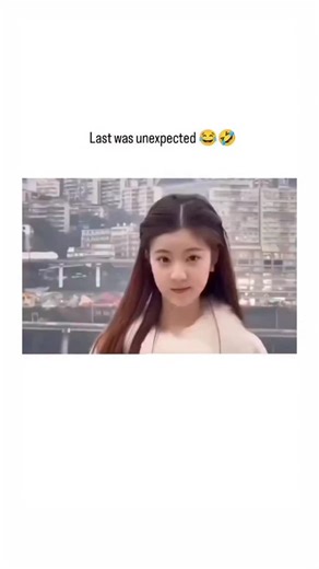 zzz on Instagram: "😂 Content Analysis: The Synchronized Scream 😂 This clip documents a highly unexpected public reaction by a group of tourists, likely in China, as they pose for a photo with a cityscape backdrop. Initially, a single woman dramatically throws her head back and emits a silent, exaggerated scream set to a pop music track. The scene abruptly cuts, revealing a whole line of people behind her, perfectly mimicking her extreme, open-mouthed expression—a mass, silent cry of shared sur