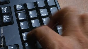 Close Up Number or Numlock Keypad Key Pressed on Black Keyboard by Finger Multiple Press for Choices