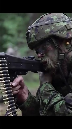 a soldier in military camouflage using the L7A2 GPMG #shortsfeed