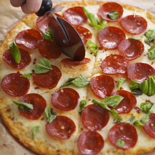 Your JUICER is the best-kept secret for perfectly crispy cauliflower crust pizza 🍕(It removes the excess liquid so it's never too soggy!) Get the recipe: https://foodtv.com/3iY9oRz | Food Network