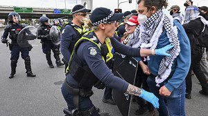 Anti-war protesters in Australia clash with police outside a weapons convention