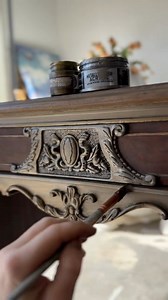 Refresh your old furniture and make it shine again! Furniture artist ​⁠ gave this gorgeous piece a makeover and the results are fabulous. She cleaned, sanded and revived the wood with a glaze and stain. The details were given a subtle metallic finish using our Metallic Sheen and Sparks acrylic paints. The layers add old world charm to match the style and charm of this piece. Our paints are high quality, with intense luster. Would you try this technique on your DIY projects? #redesignwithprima #f