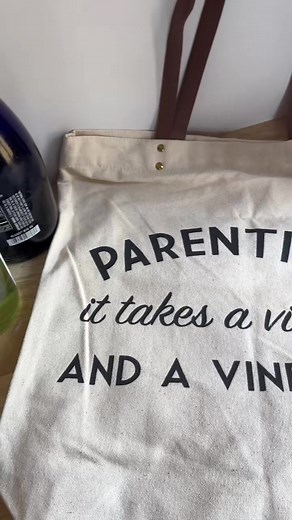 Introducing the 'Parenting: It Takes a Village and a Vineyard' bag from Fun Club - your new parenting survival kit. Carry it proudly as a symbol of the village that supports you and the vineyard that helps you unwind. Cheers, fellow parents! 🍷🌟 #FYP #GiftIdeas #Bags #ShopFunClub #StatementPiece #BagObsession | Fun Club