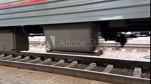 The train is moving along the rails. Close-up view