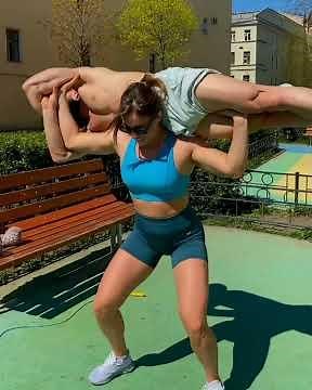 Girl lifts a guy overhead 3