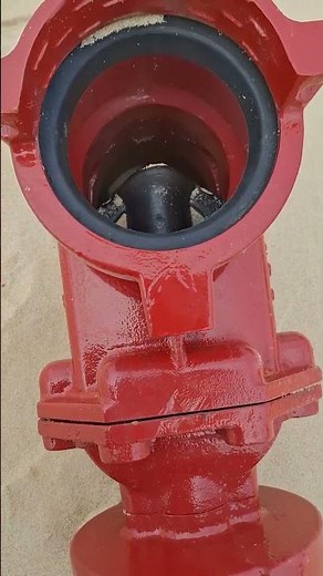 How does a gate valve open and close?