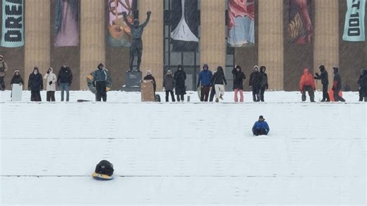 Winter revellers sled down iconic Philadelphia Art Museum steps