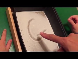 ABC writing on the Sand
