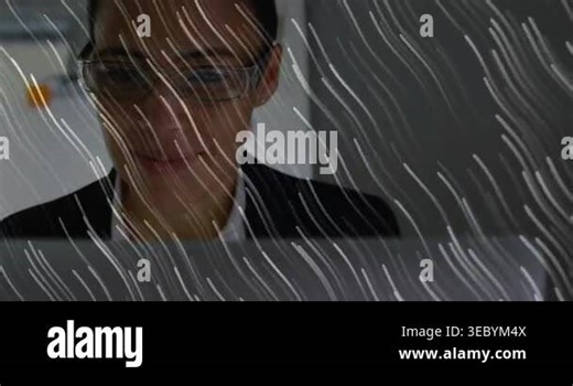Woman typing on laptop camera shifting revealing white streaks passing over laptop, working on tech. Computer, desk, office, board, notes, focus, modern Stock Video Footage - Alamy