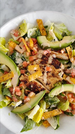 This Santa Fe Chicken Salad is a perfect Chili's copycat recipe loaded with spicy chicken, yummy veggies, tortilla strips and Santa Fe sauce. PRINT RECIPE: https://thegirlonbloor.com/chilis-santa-fe-chicken-salad/#recipe | The Girl on Bloor - Healthy, easy recipes for busy people