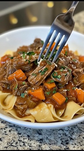 Slow Cooker Beef Ragu This deeply flavorful beef ragu is slow-cooked to perfection with tomatoes, garlic, herbs, and tender chunks of beef that fall apart with a fork. It’s a cozy, no-fuss meal that fills the house with incredible aromas and tastes like you’ve been cooking all day, because, well, you have (but your slow cooker did all the work!). Ingredients: 2.5–3 lbs beef chuck roast, trimmed and cut into large chunks 1 tbsp olive oil 1 small onion, finely chopped 3 cloves garlic, minced 1 (6 