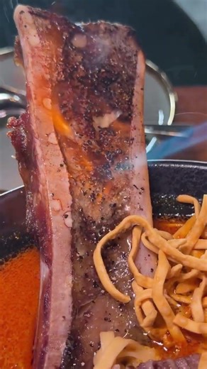 Giant dinosaur size bone marrow kao soi in Las Vegas at Amata modern Thai restaurant