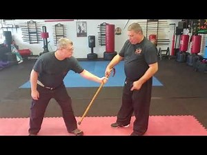 Cane self-defense from wrist grab.